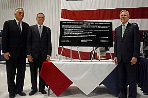 The Governor of Virginia, Secretary of the Navy & Dominion CEO sign an energy initiative agreemnt on a ceremonial solar panel at Ocean Naval Air Station